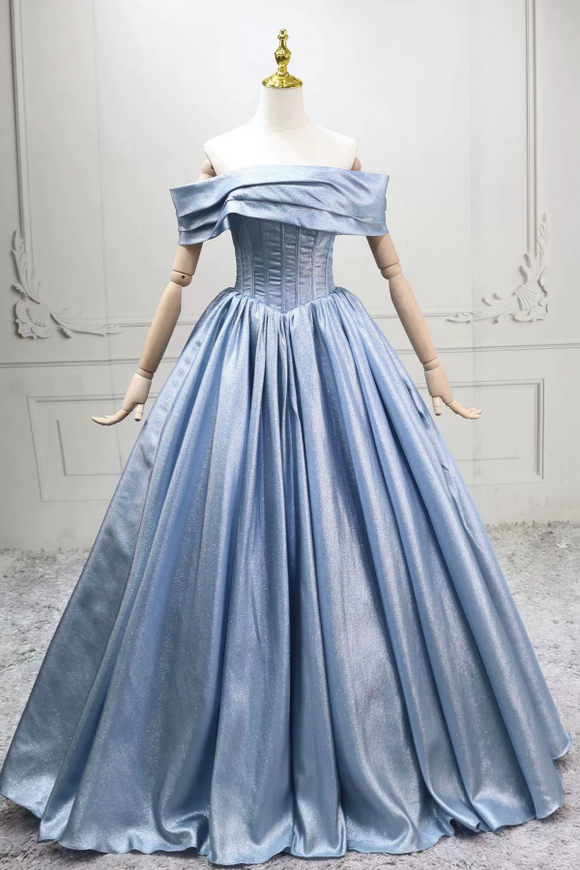 Blue evening gown on a mannequin against a light gray background