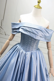 Light blue off-shoulder dress on a mannequin against a neutral background