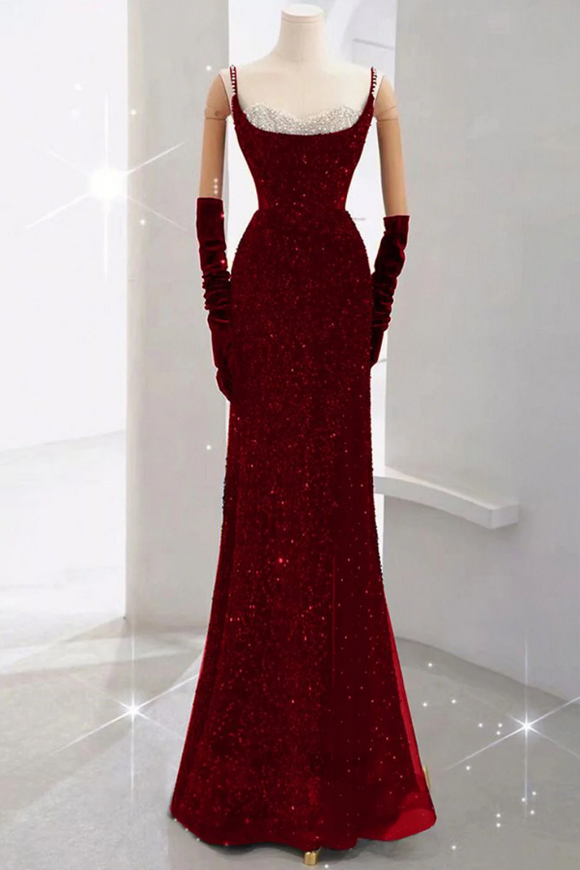 Red evening gown on a mannequin with gloves against a white background