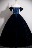 Navy blue ball gown on a mannequin against a plain background