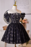 Black lace dress on a mannequin with a decorative background