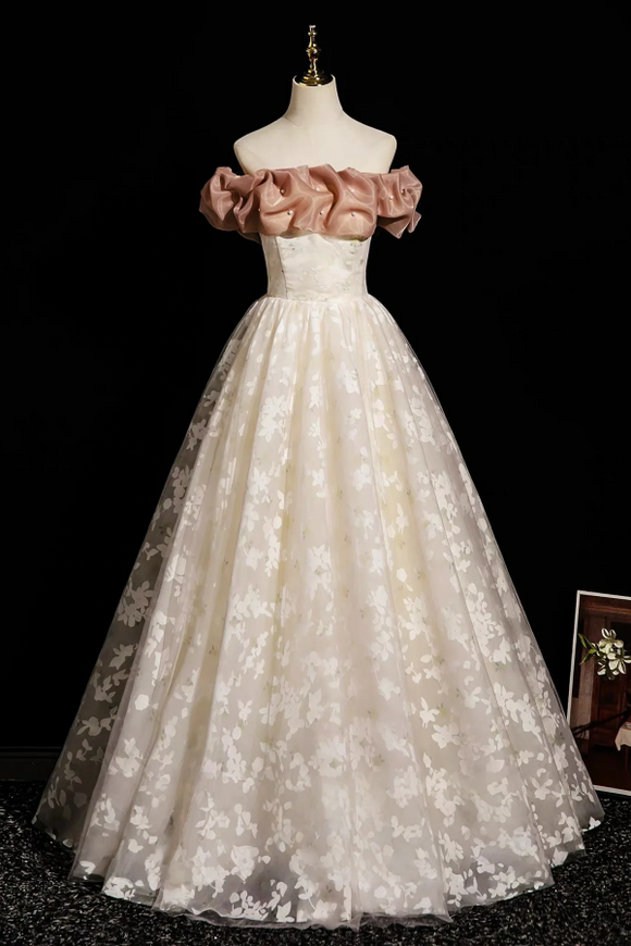 White lace dress with pink ruffled top on a mannequin against a black background