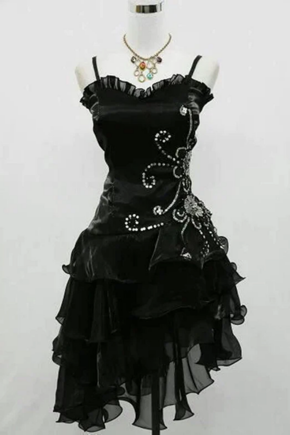 Black dress with floral embellishments on a white background