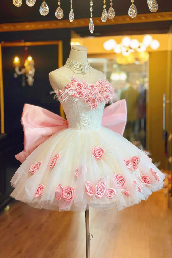 White dress with pink floral embroidery on a mannequin in a decorated room.