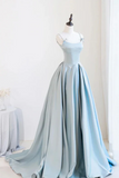 Light blue evening gown on a mannequin against a white background
