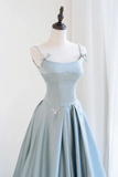 Light blue dress on a mannequin against a white background