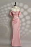 Pink evening gown on a mannequin against a neutral background