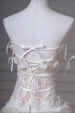 White lace wedding dress on a mannequin with a neutral background