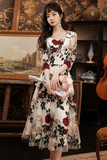 Woman in a floral dress standing in an elegant interior setting
