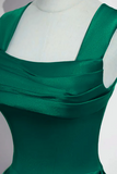 Green dress on a mannequin against a neutral background
