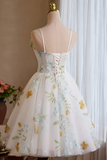 White floral dress on a mannequin against a neutral background