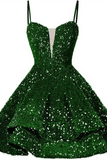 Green sequin dress with thin straps on a white background
