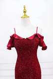 Red sparkly dress on a mannequin with a white background