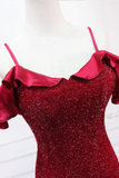 Red glittery dress with thin straps on a mannequin against a white background