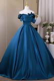 Blue evening gown on a mannequin against a neutral background