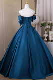Blue evening gown on a mannequin against a neutral background