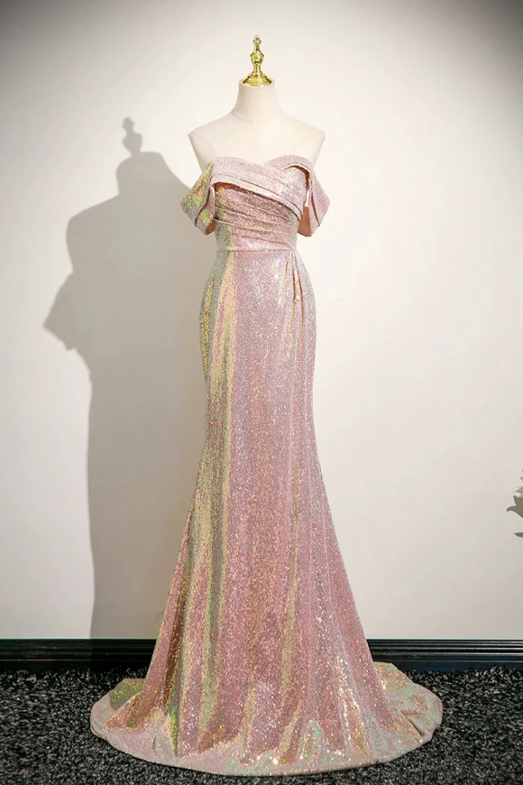 Pink evening gown with gold accents on a mannequin against a white background