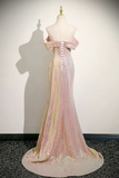 Iridescent evening gown on a mannequin against a plain background