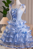 Blue dress with ruffles and bows on a mannequin against a neutral background