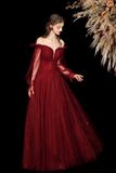 Woman wearing a burgundy off-shoulder gown against a dark background with decorative elements.