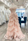 Pink lace evening gown on a mannequin in a store setting
