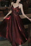 Woman wearing a red metallic dress in an indoor setting