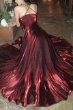 Red satin gown with a flowing skirt on a person.