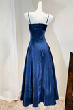 Blue evening gown on a mannequin against a white background