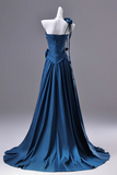 Blue evening gown on a mannequin against a gray background