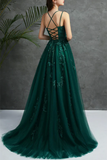 Green evening gown with intricate detailing on a neutral background