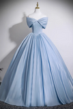 Light blue evening gown on a mannequin against a plain background