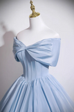 Light blue off-shoulder dress on a mannequin against a plain background