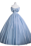 Blue evening gown on a mannequin against a white background