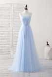 Light blue evening gown on a mannequin against a white background