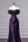 Purple evening gown on a mannequin against a plain background