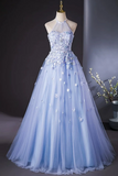 Light blue evening gown with floral details on a mannequin against a neutral background.