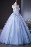 Light blue evening gown with floral embellishments on a mannequin against a dark background.