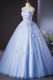 Light blue evening gown with floral embellishments on a mannequin against a dark background.