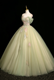 Light green ball gown on a mannequin against a black background