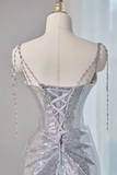 Silver sequin dress on a mannequin with a gray background
