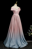 Pink to blue gradient evening gown on a mannequin against a dark background