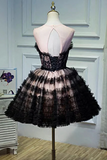 Black and white lace dress on a mannequin against a white wall.