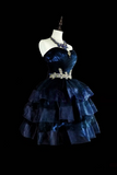 Navy blue dress with a silver belt on a mannequin against a black background
