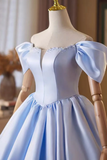 Light blue dress on a mannequin with a blurred background