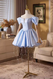 Light blue dress on a mannequin in a room with decor elements.