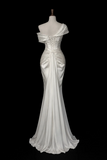 An off-the-shoulder white satin evening gown displayed on a mannequin against a solid black background.