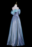 A floor-length off-the-shoulder gown displayed on a mannequin against a black background. The dress has a shimmering light blue to lavender-blue satin-like skirt with a structured corset-style bodice and voluminous ruffled sleeves.