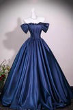 A royal blue satin off-the-shoulder ball gown displayed on a white mannequin against a neutral gray background.